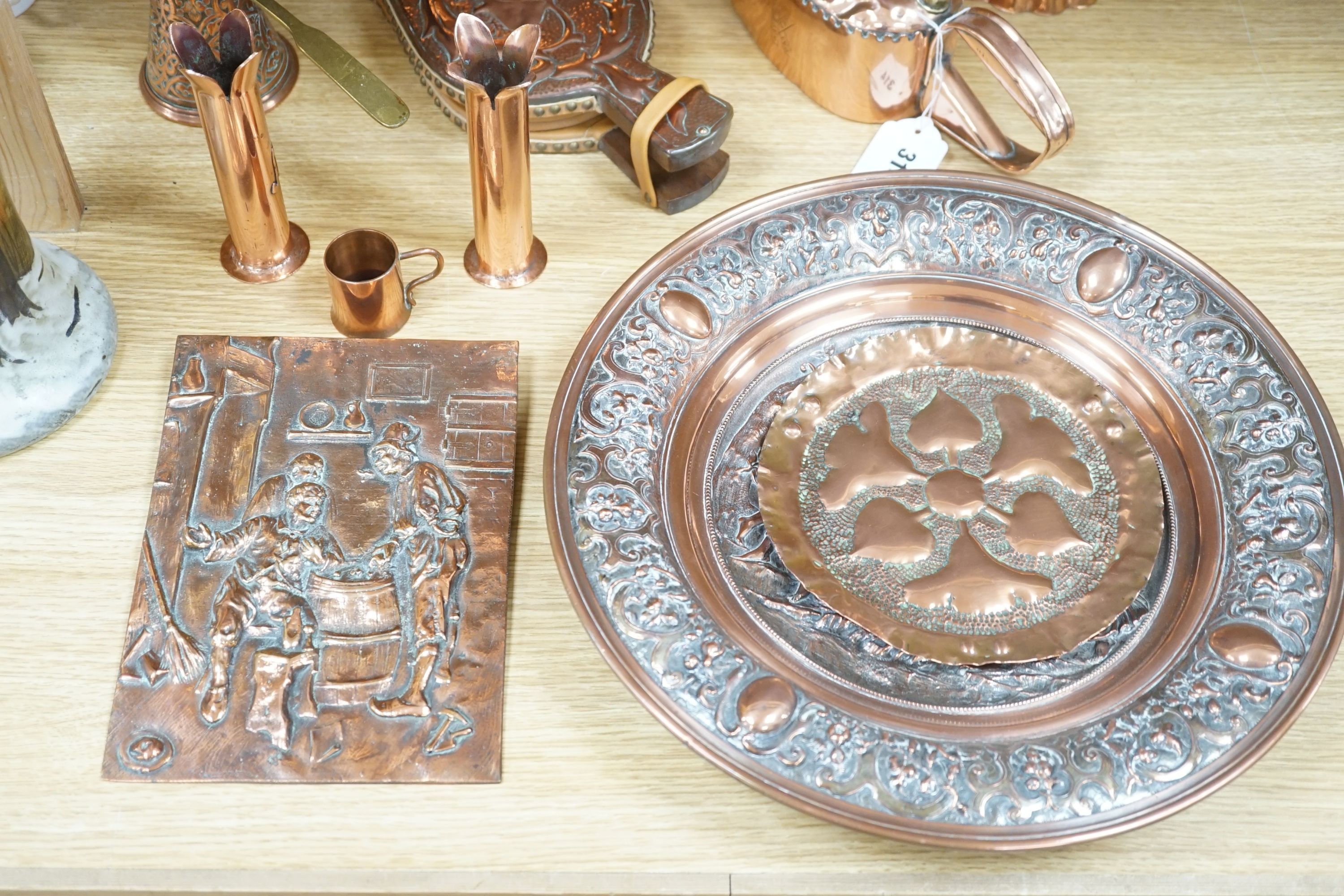 A Newlyn copper wall sconce, 24cm, a quantity of copperware including a decorative plaque and jelly mould